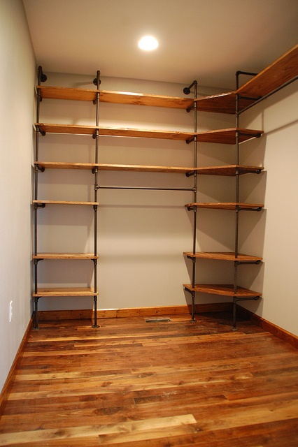 diy-closet-organizer-pipes-pine-shelves